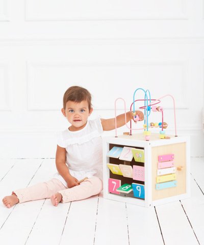 pink wooden activity cube