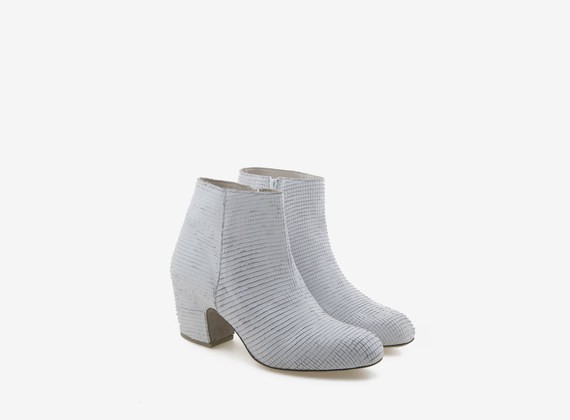 Wrapped engraved leather white ankle boot