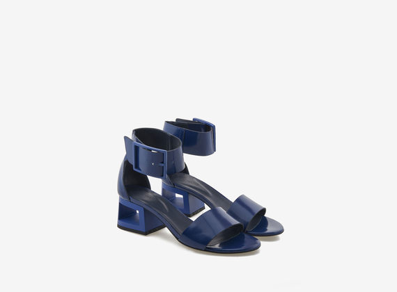 Blue brushed leather sandal with perforated heel