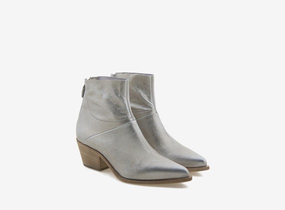 Laminated platinum leather ankle boot with zipper