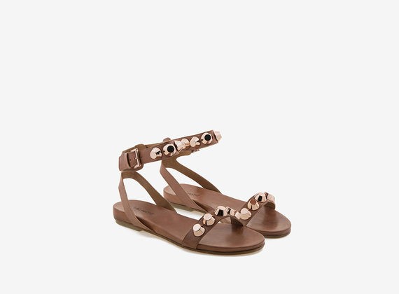 Leather sandal with maxi copper-colour studs