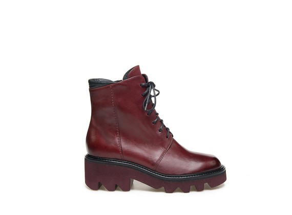Burgundy military boots with matching rubber chunky soles