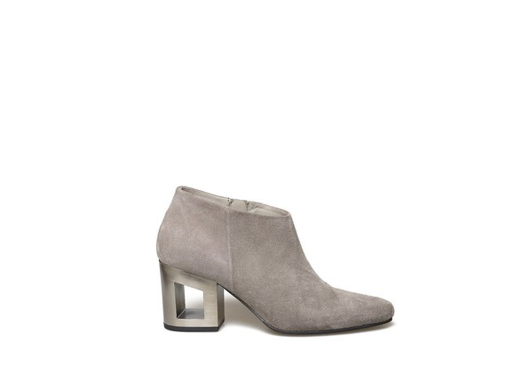 Grey suede ankle boot with perforated heel