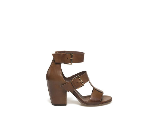 Cognac-coloured sandal with buckles and shell-shaped heel