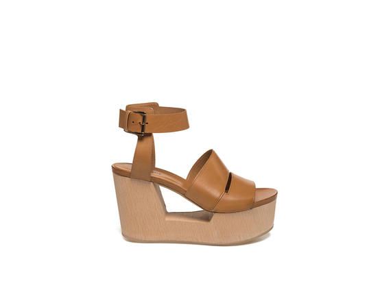 Hide-coloured sandal on perforated wooden wedge