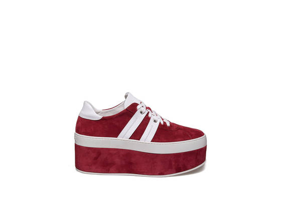 Lace up shoe with bands on red suede platform