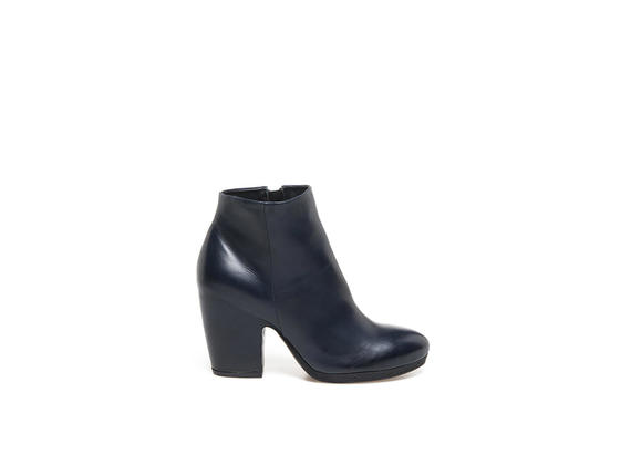 Midnight blue leather ankle boot with shell-shaped heel