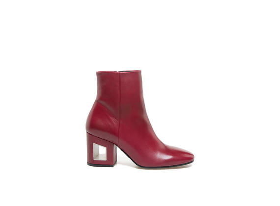 Red leather ankle boots with perforated heel