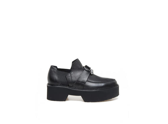 Moccasins in black leather with piercing and maxi rubber bottom