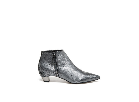 Carved metallic leather ankle boots with side zip and metal heel