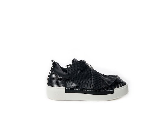 Perforated leather slip-on with black ruffles