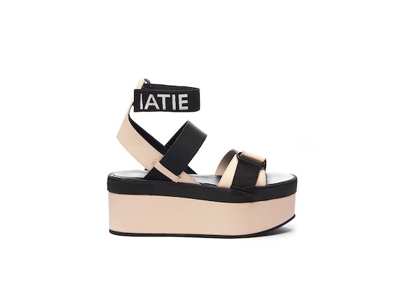 Sandal with a dusty pink wedge, Velcro and ankle strap with logo