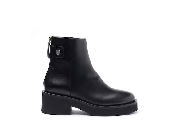 Black leather heeled ankle boots with press-stud and rubber sole
