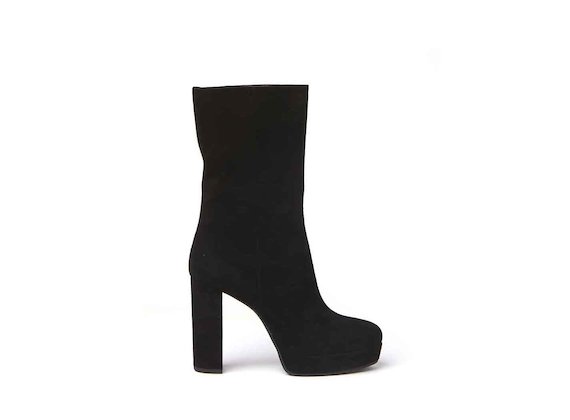 Black suede stove pipe boots with suede-covered platform and heel