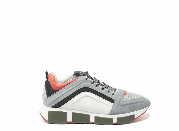 Grey/orange running shoes with raised 3D detail