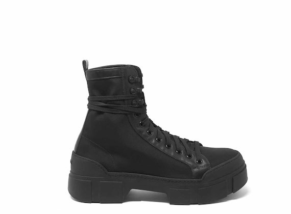 Black combat boots with lug soles