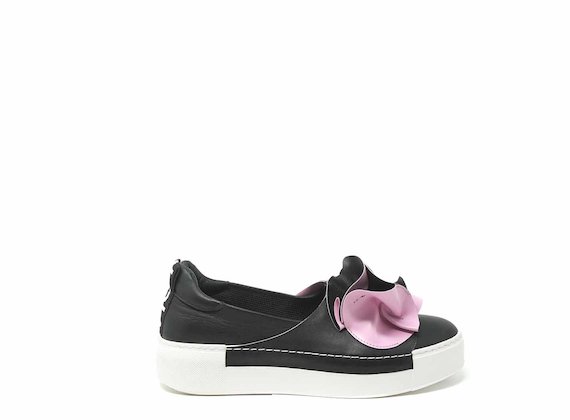 White and fuchsia slip-ons with large origami flower