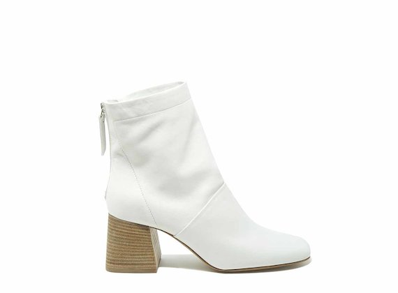 White ankle boots with flared heels