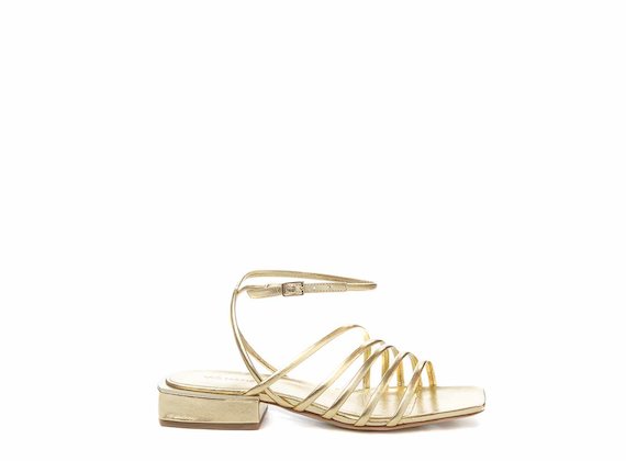Flat golden sandals with strips and ankle strap - Gold