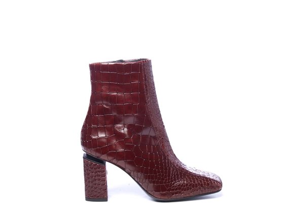 Ruby-red crocodile-print leather ankle boots with suspended heels