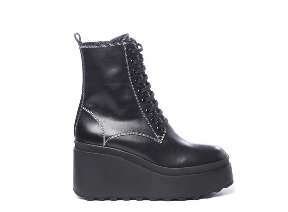 Black calfskin combat boots with wedge