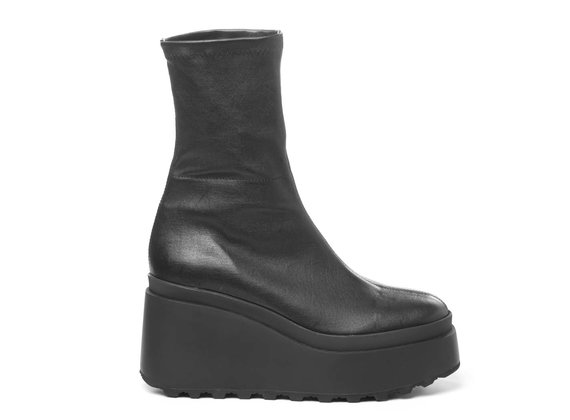 Black ankle boots in soft stretch leather with wedge